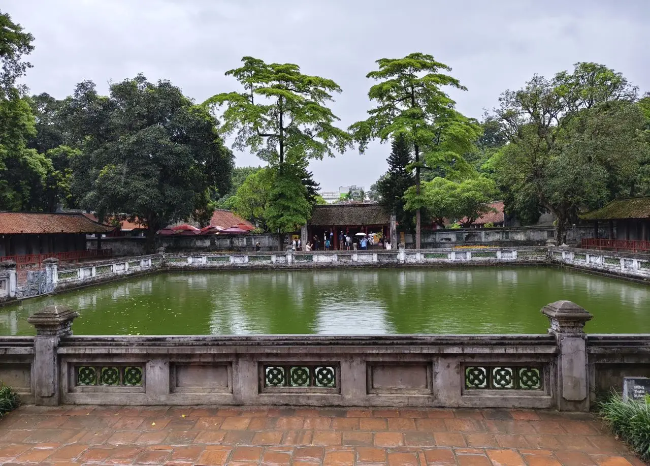 Temple Of Literature In Hanoi Showcases Vietnam’s Ode To Academic Excellence 6 Heavenly Well at the Temple of Literature in Hanoi, a tranquil rectangular pond symbolising wisdom, framed by stone balustrades and ancient trees.