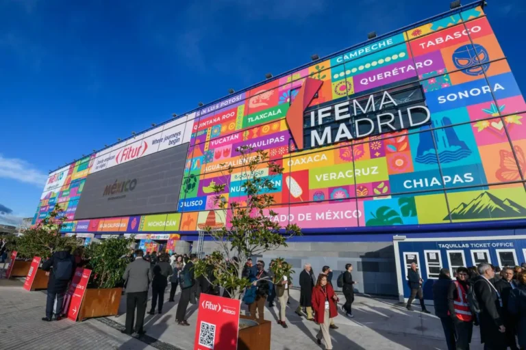 Crowds gather outside IFEMA Madrid during FITUR 2026, with a colourful Mexico-themed facade displaying regional names and travel branding.