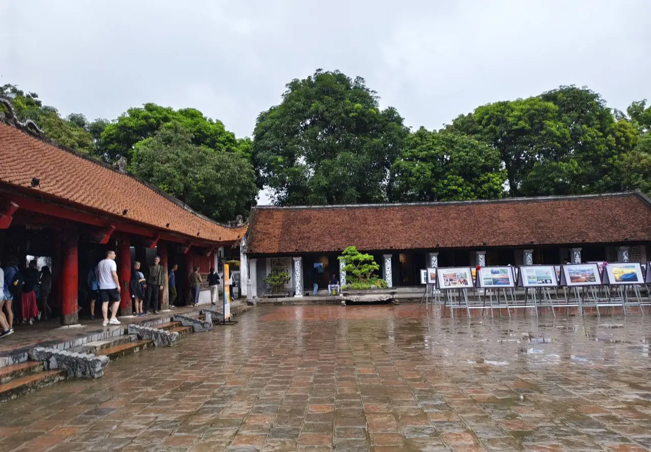 Temple Of Literature In Hanoi Showcases Vietnam’s Ode To Academic Excellence 9 Final courtyard of the Temple of Literature in Hanoi, featuring red-tiled buildings, open stone paving, and exhibition displays in the former Imperial Academy grounds.