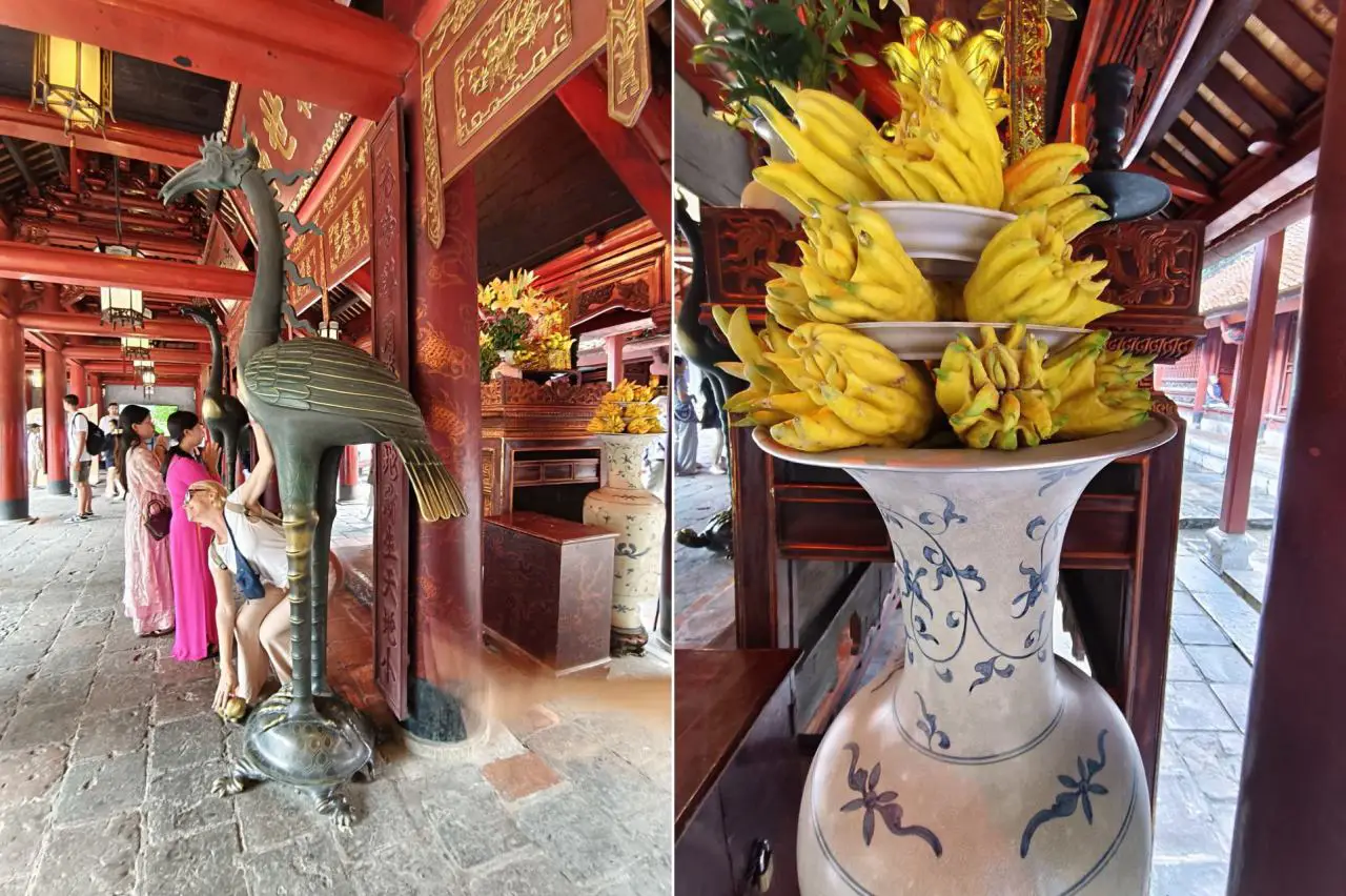 Temple Of Literature In Hanoi Showcases Vietnam’s Ode To Academic Excellence 10 Visitors inside the Temple of Literature shrine in Hanoi, with a bronze crane statue and traditional fruit offerings placed on ornate altars.