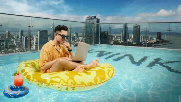 Other News 5 Young traveler working on a laptop while floating on an inflatable ring in a rooftop pool overlooking a modern city skyline at Wink Hotel.
