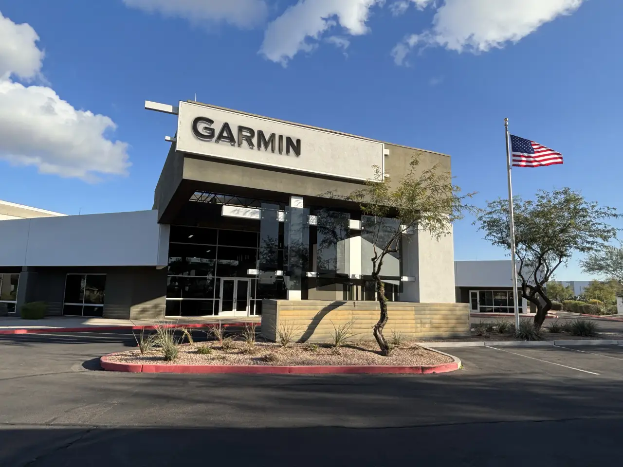 Garmin aviation facility building at Mesa Gateway Airport with American flag outside