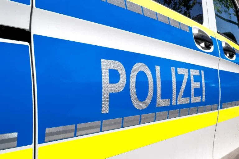 German police vehicle with “Polizei” lettering during public security patrol at a major event