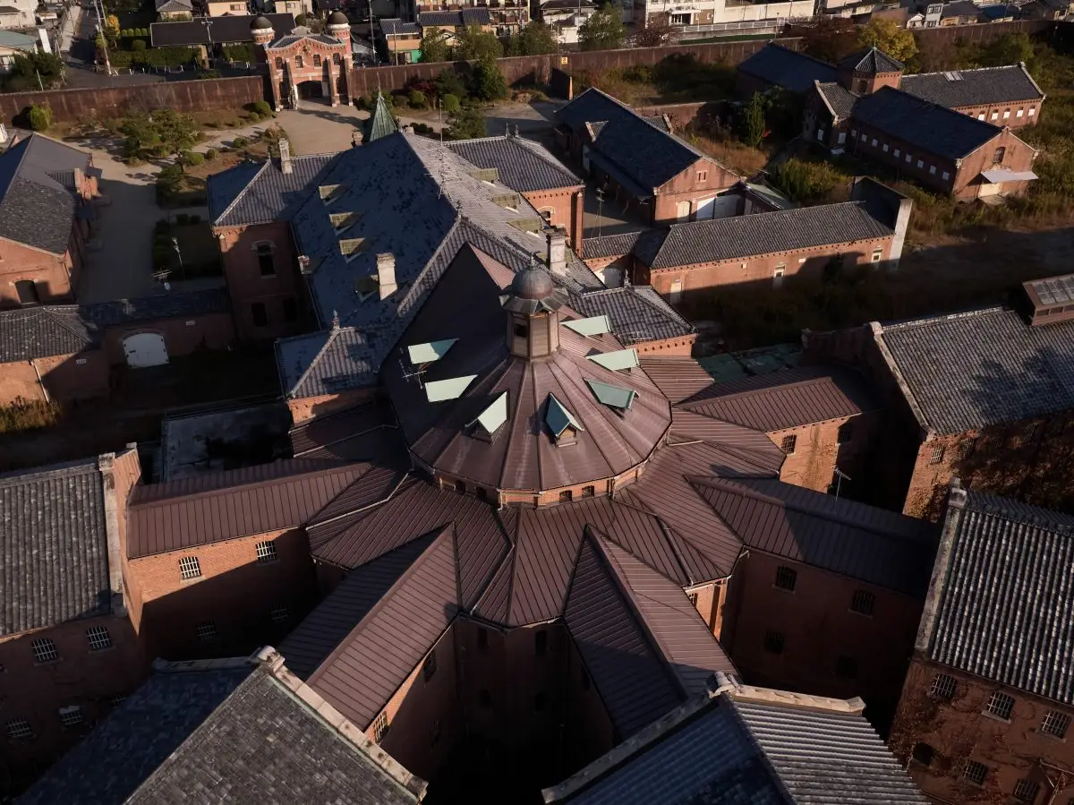 Aerial exterior view of HOSHINOYA Nara Prison, a historic red brick former prison in Japan transformed into a luxury hotel