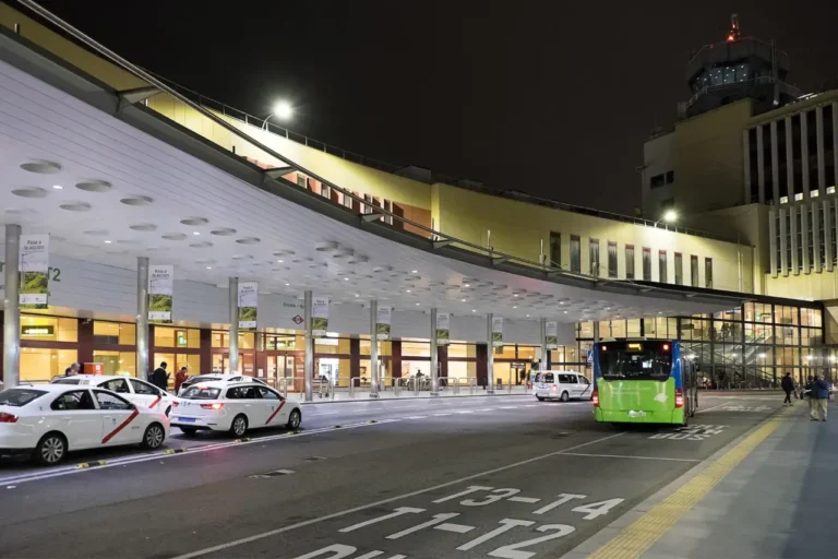 Spain Travel And Tourism News 8 Night view of Terminal 2 at Adolfo Suárez Madrid Airport with taxis and a city bus outside the arrivals area
