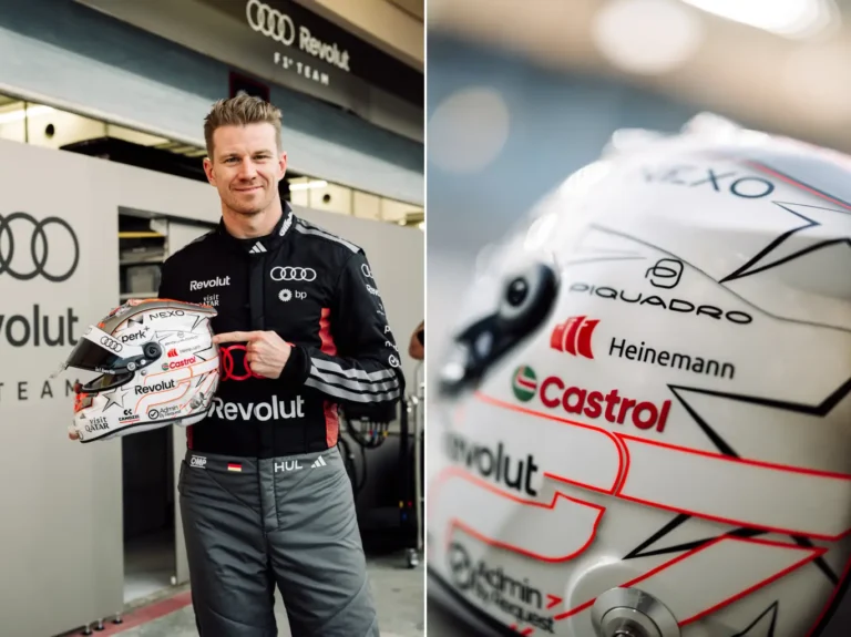 Sports Tourism 18 Formula 1 driver Nico Hulkenberg stands in the Audi garage holding his racing helmet featuring Heinemann branding, with a close-up of the helmet logos beside him.