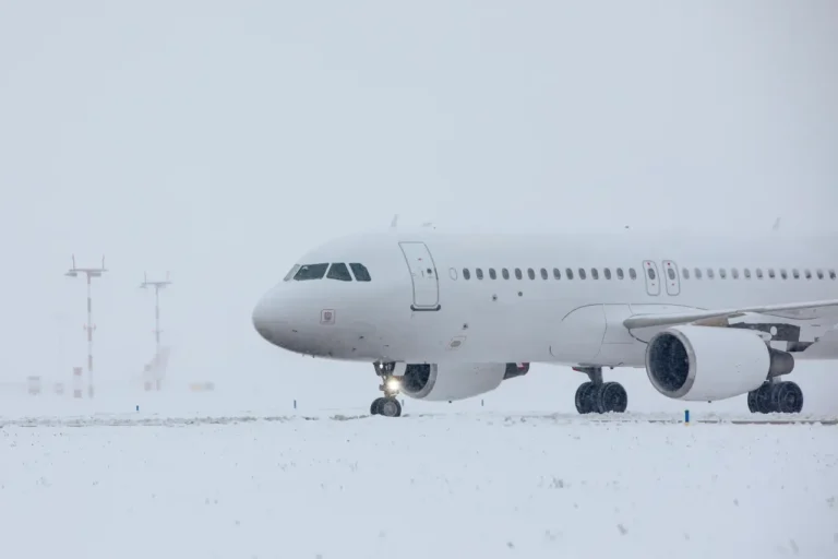 Other News 20 Passenger airplane taxiing on a snow-covered runway during heavy snowfall at an airport in winter