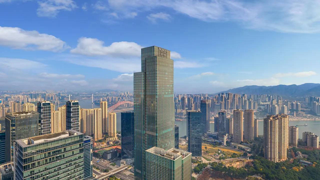 Ihg’s Vignette Collection Reaches 10 Open Hotels In Greater China 4 High-rise luxury hotel tower overlooking Chengdu skyline with river and city buildings in daylight