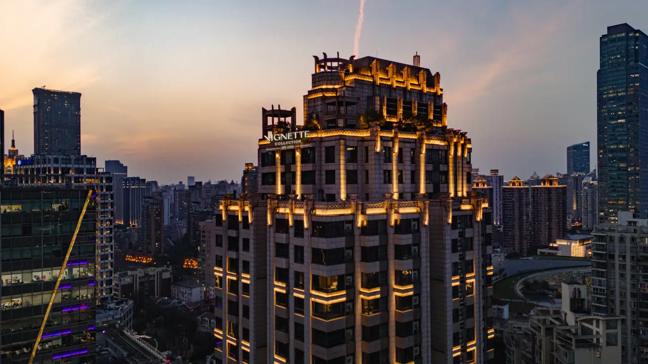 Ihg’s Vignette Collection Reaches 10 Open Hotels In Greater China 5 Illuminated Vignette Collection hotel tower in Shanghai at sunset, surrounded by city skyscrapers