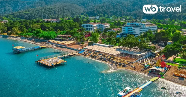 Beachfront WB Travel resort in Kemer, Turkey with pier, sun loungers and turquoise sea