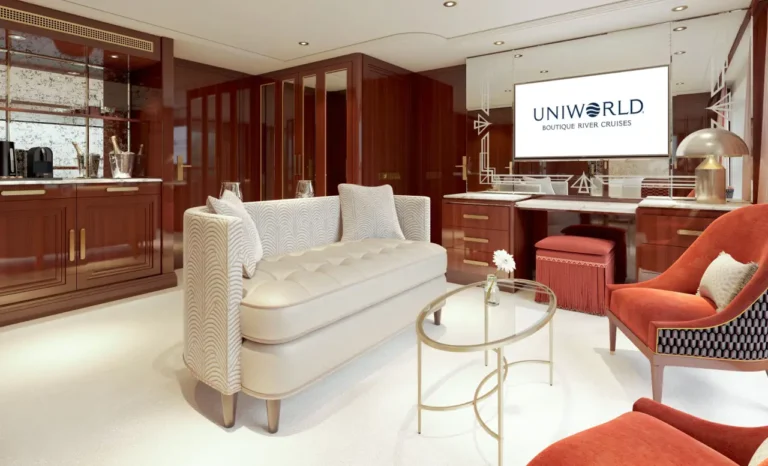 Luxury river cruise suite living room with elegant furniture, warm wood interiors and modern design details
