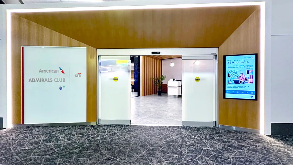 Entrance to American Airlines Admirals Club lounge with Citi branding at a US airport