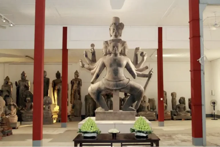 Other News 4 Restored Dancing Shiva statue displayed in a museum in Cambodia, featuring multiple arms and detailed ancient stone craftsmanship