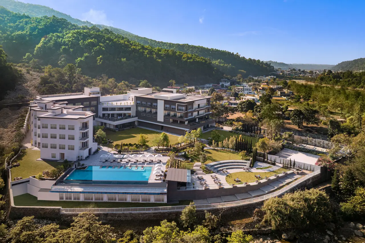 Le Méridien Dehradun Resort & Spa aerial view in the Doon Valley with pool and Himalayan foothills