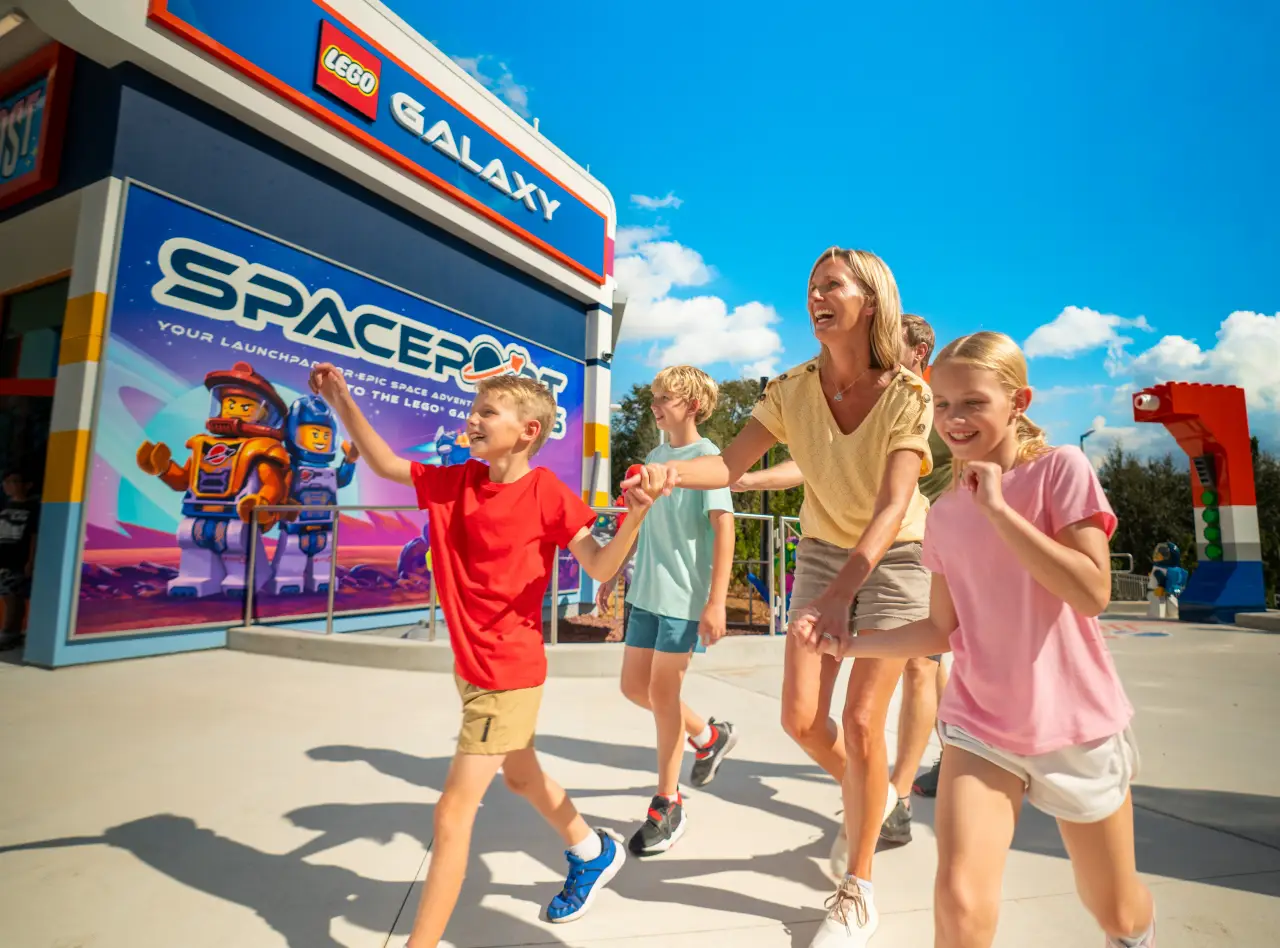 Family arriving at LEGO Galaxy Spaceport entrance at LEGOLAND California Resort during spring break travel season
