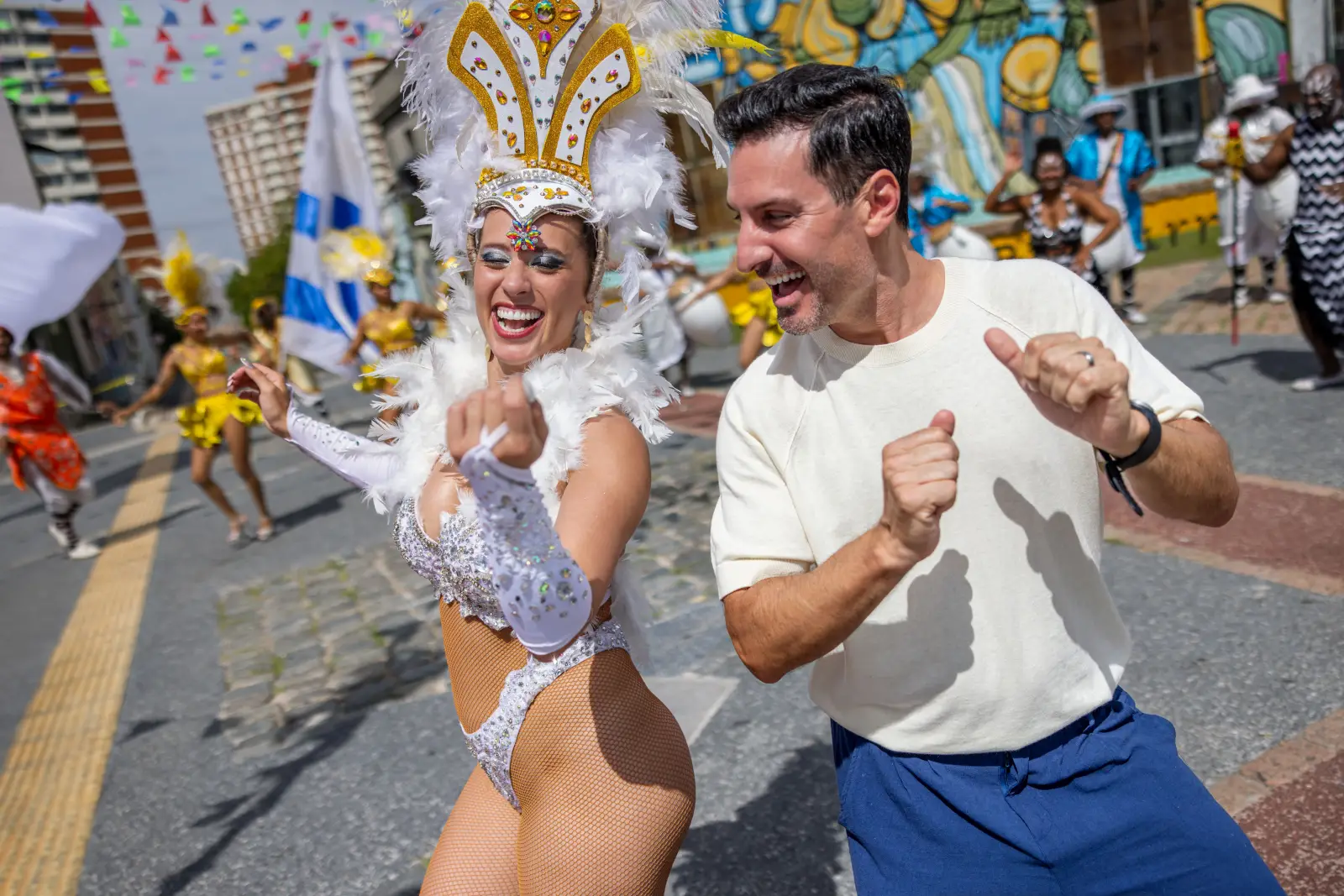 Princess Cruises Announces 2027-28 South America Season : Explore 19 Destinations, 15 Unesco Sites, And Antarctica 4 Tourist dancing with carnival performer in Montevideo Uruguay during a cultural cruise excursion