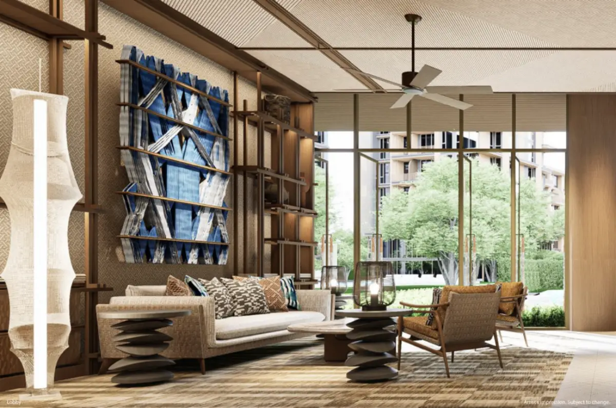 Modern tropical lobby interior at PEYLAA Phuket Autograph Collection Residences with lounge seating, art wall, and floor-to-ceiling windows overlooking landscaped gardens.