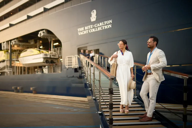 Passengers boarding The Ritz Carlton Yacht Collection luxury yacht at embarkation