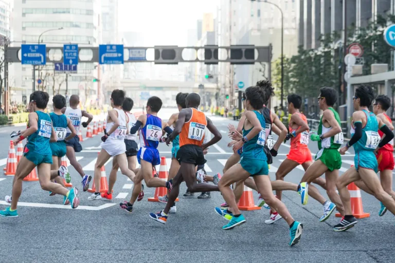 Sports Tourism 15 Runners competing in the Tokyo Marathon through central Tokyo city streets