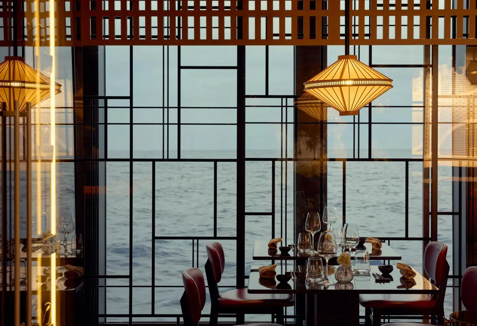 Luxury cruise ship restaurant with ocean views and Japanese-inspired design