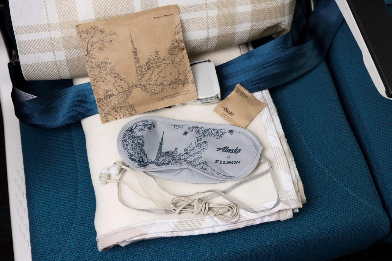 Alaska Airlines Unveils Its First-Ever International Business Class Suites Experience 5 Alaska Airlines business class amenity kit with eye mask, headphones and premium travel accessories on seat