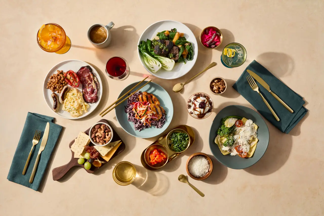 Alaska Airlines Unveils Its First-Ever International Business Class Suites Experience 4 Alaska Airlines business class dining with multi-course meals, gourmet dishes and drinks served onboard