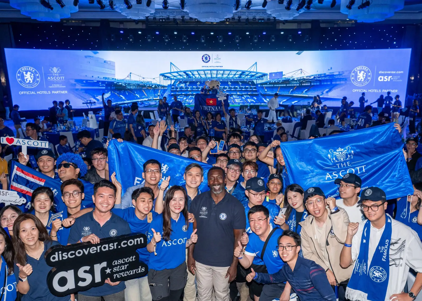 Jimmy Floyd Hasselbaink poses with Chelsea fans at Night with the Blues event in Hanoi