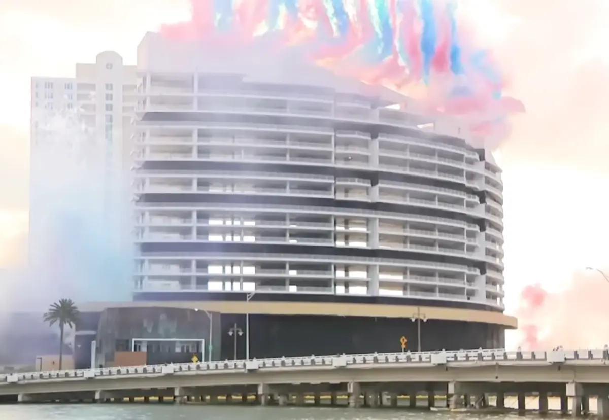 Controlled implosion of Mandarin Oriental Miami hotel on Brickell Key as building collapses with smoke and debris during demolition