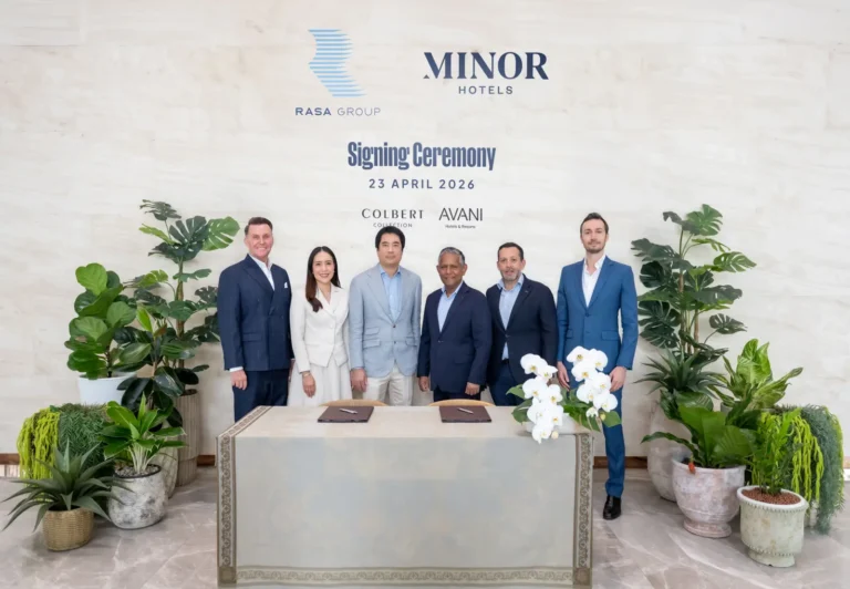 Executives from Minor Hotels and Rasa Group pose during a hotel signing ceremony announcing Koh Samui and Koh Phangan resort deals in Thailand.