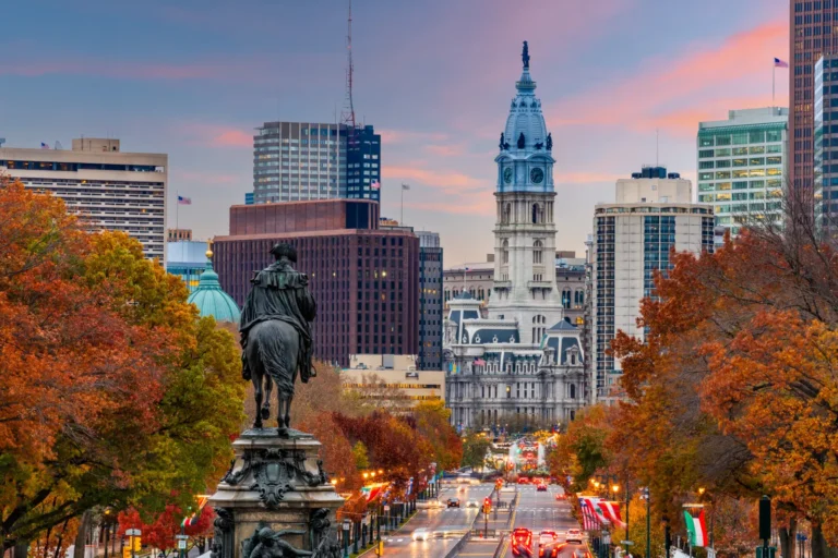 Philadelphia skyline in autumn with Benjamin Franklin Parkway and City Hall