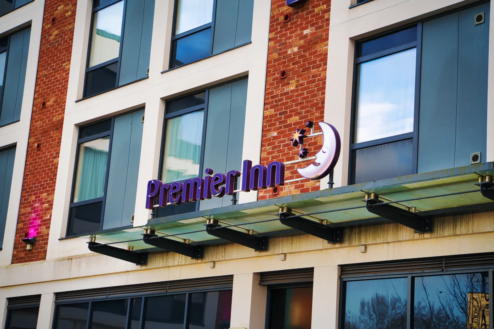 Premier Inn hotel exterior with purple logo in Northampton