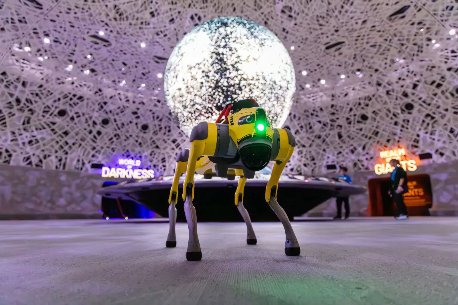AI-powered robodog at Mandai Wildlife Reserve Exploria attraction interacting with visitors inside immersive digital exhibit space