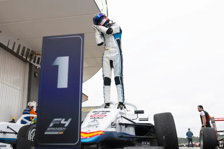 Vivek Kanthan celebrates on top of his Formula 4 car after winning at Circuit Ricardo Tormo in Valencia