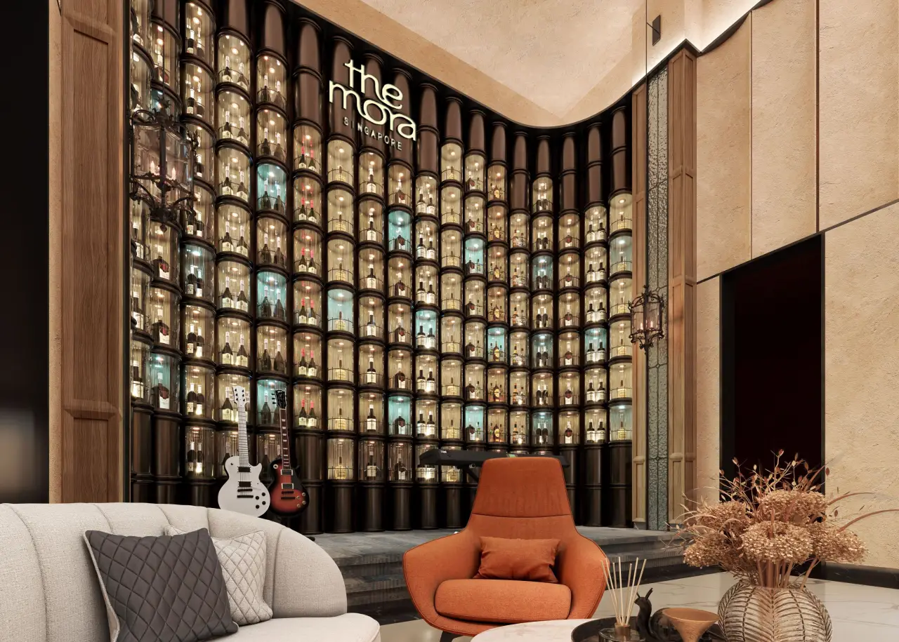 Luxury lobby at The Mora Singapore hotel with illuminated bottle wall and lounge seating