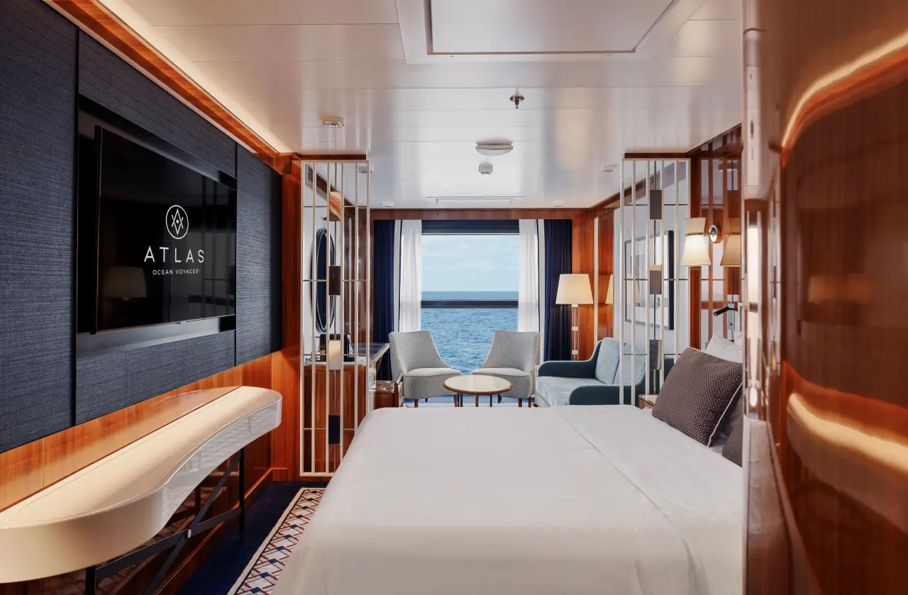 Atlas Ocean Voyages suite with ocean view, modern design and spacious luxury cruise accommodation