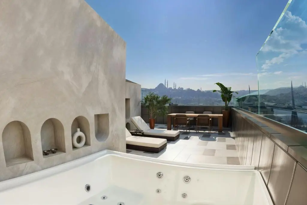 Istanbul Leads Europe In New Hotel Openings For 2026 11 Private rooftop jacuzzi terrace at Aloft Istanbul Karaköy overlooking Istanbul skyline and historic mosques under clear blue skies