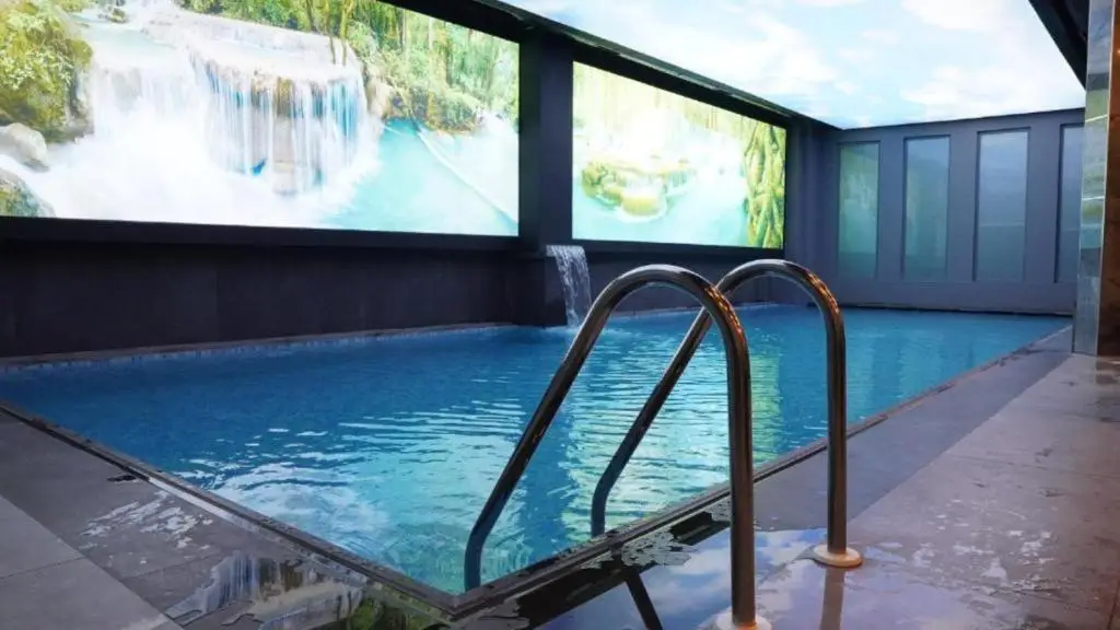 Istanbul Leads Europe In New Hotel Openings For 2026 5 Indoor swimming pool and spa area at Elite World INN Istanbul Mahmutbey with illuminated waterfall-themed wall displays