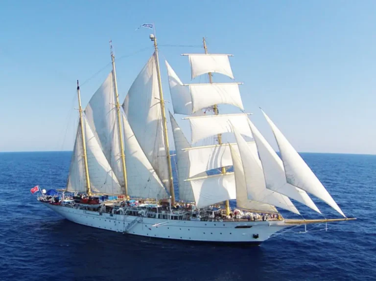 Star Clipper tall ship sailing under full canvas in calm blue seas