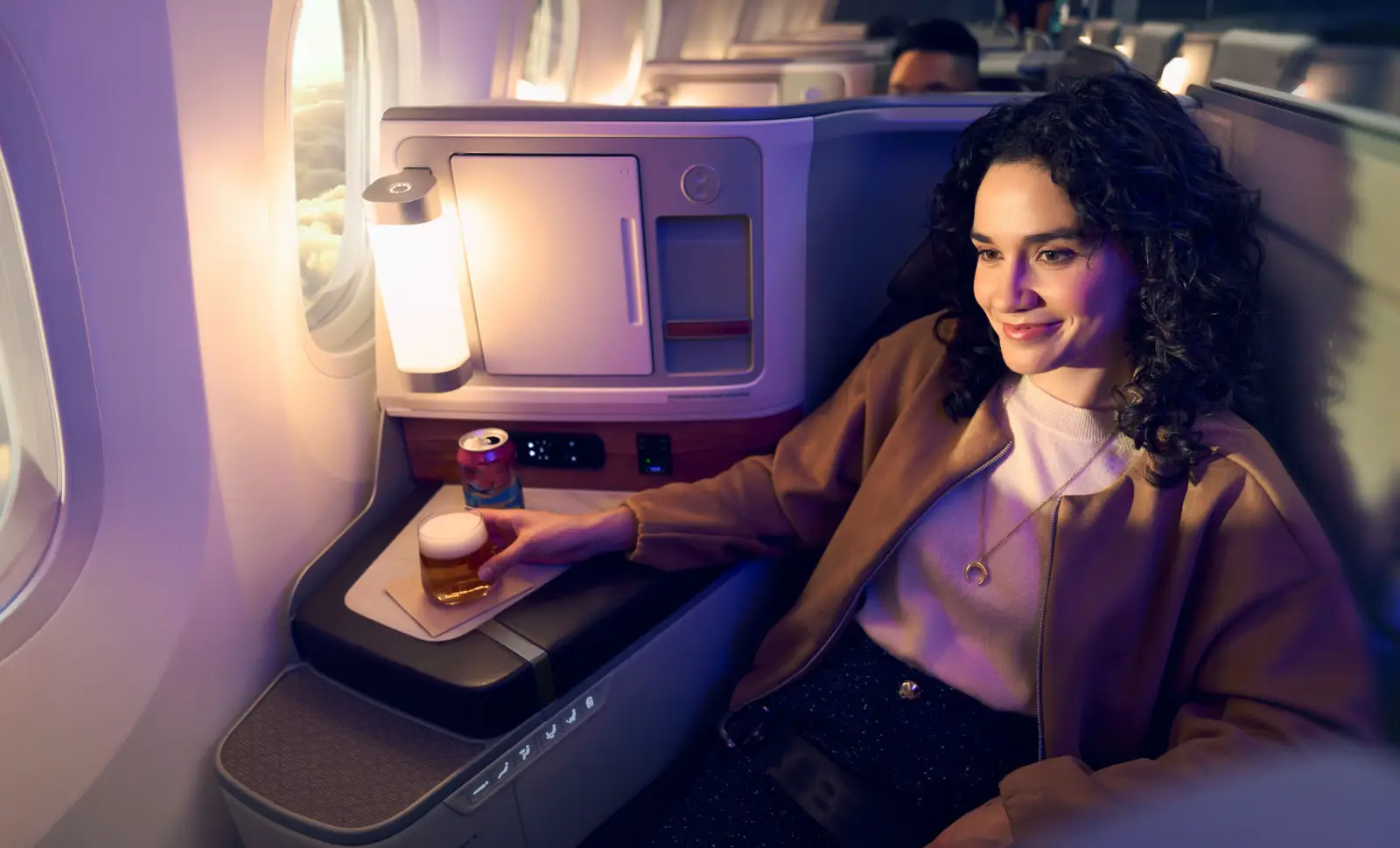 Alaska Airlines Launches Historic First Nonstop Flight Between Seattle And Rome 4 Passenger relaxes in Alaska Airlines international business class Suite on Boeing 787-9
