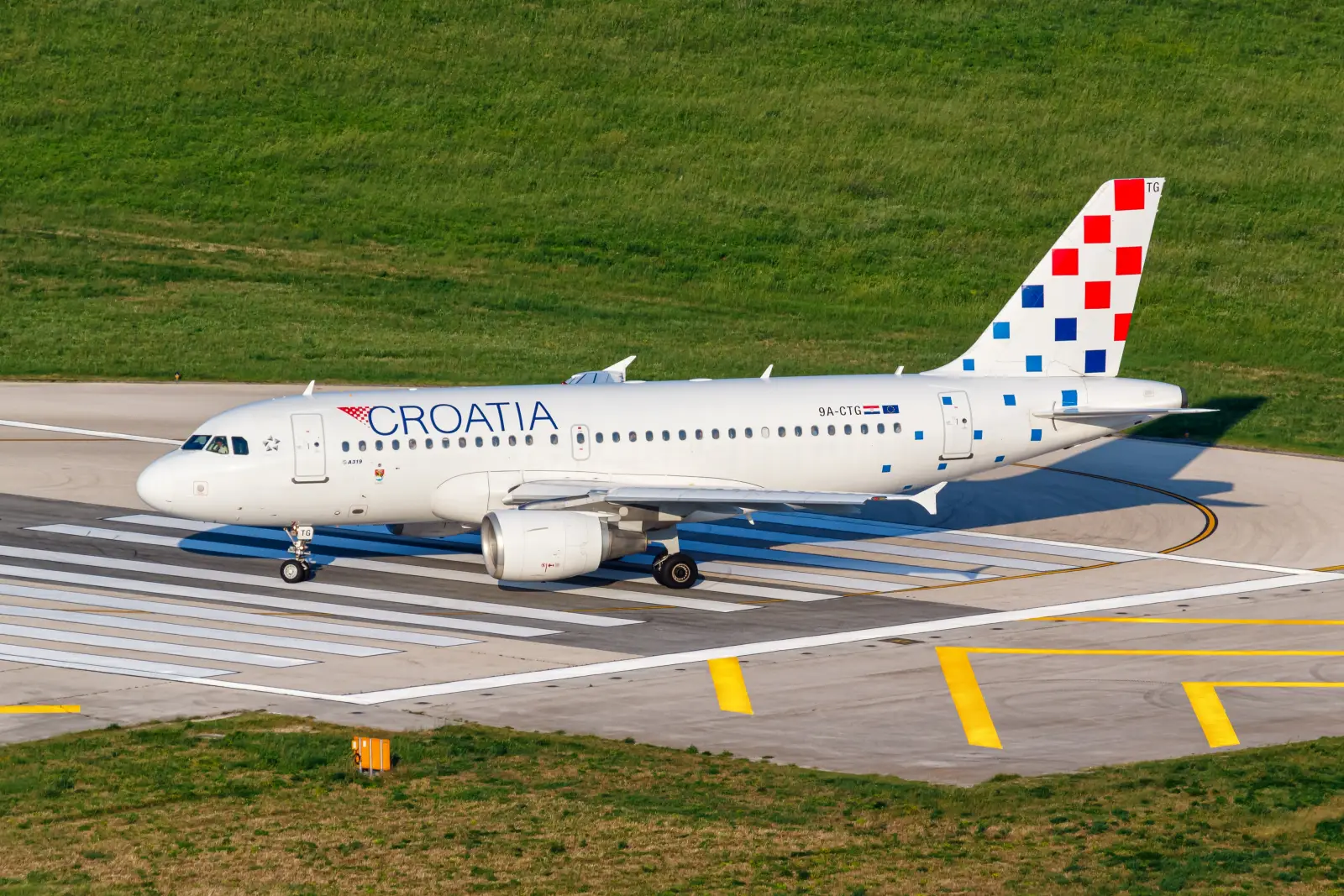 A Croatia Airlines Airbus A319 aircraft with registration 9A-CTG taxiing on a runway.