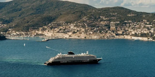 EXPLORA III luxury cruise ship sailing near a coastal town in Northern Europe during its 2026 maiden season