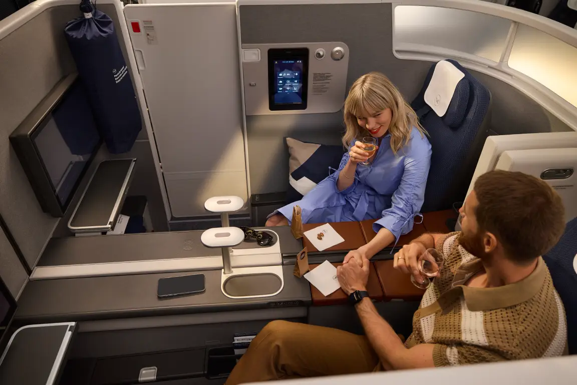 Lufthansa’s Allegris First Class And Business Class Announced For Singapore 3 Passengers relaxing in Lufthansa Allegris Business Class Couple Suite with double seating, privacy partitions and premium in-flight entertainment