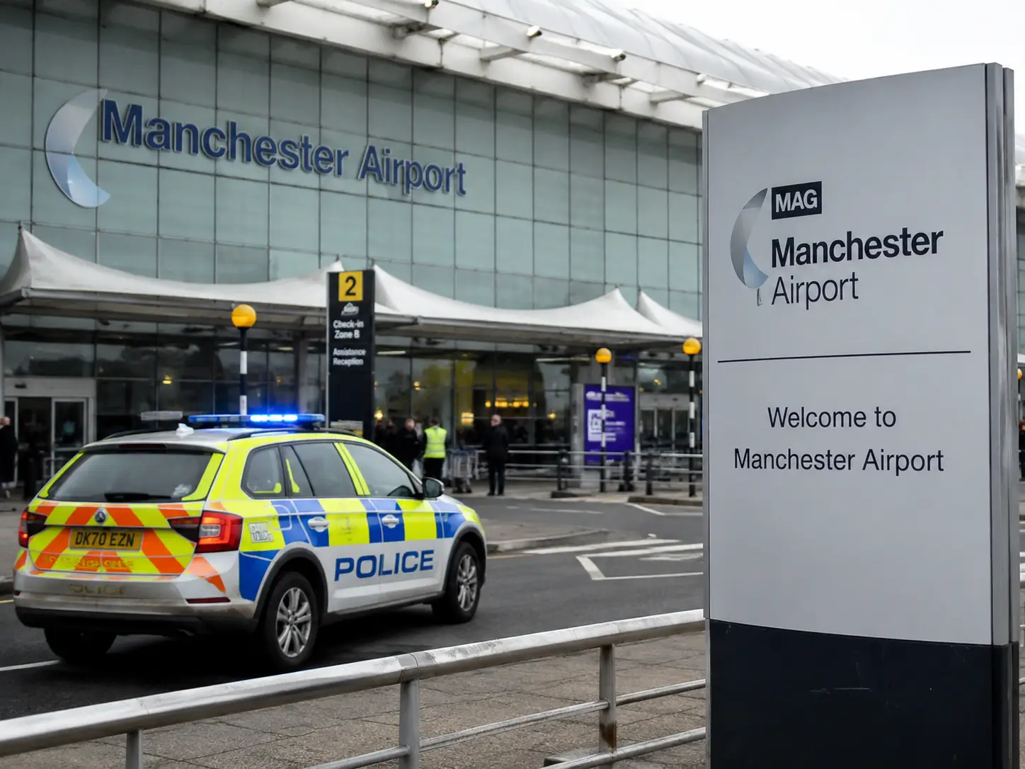 Police vehicle outside Manchester Airport after two flight attendants were arrested following reported alcohol test breaches.