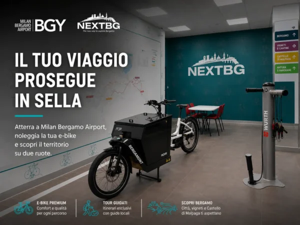 Wide view of Milan Bergamo Airport’s NextBG e-bike rental area with premium electric bike station and Bergamo tour branding.