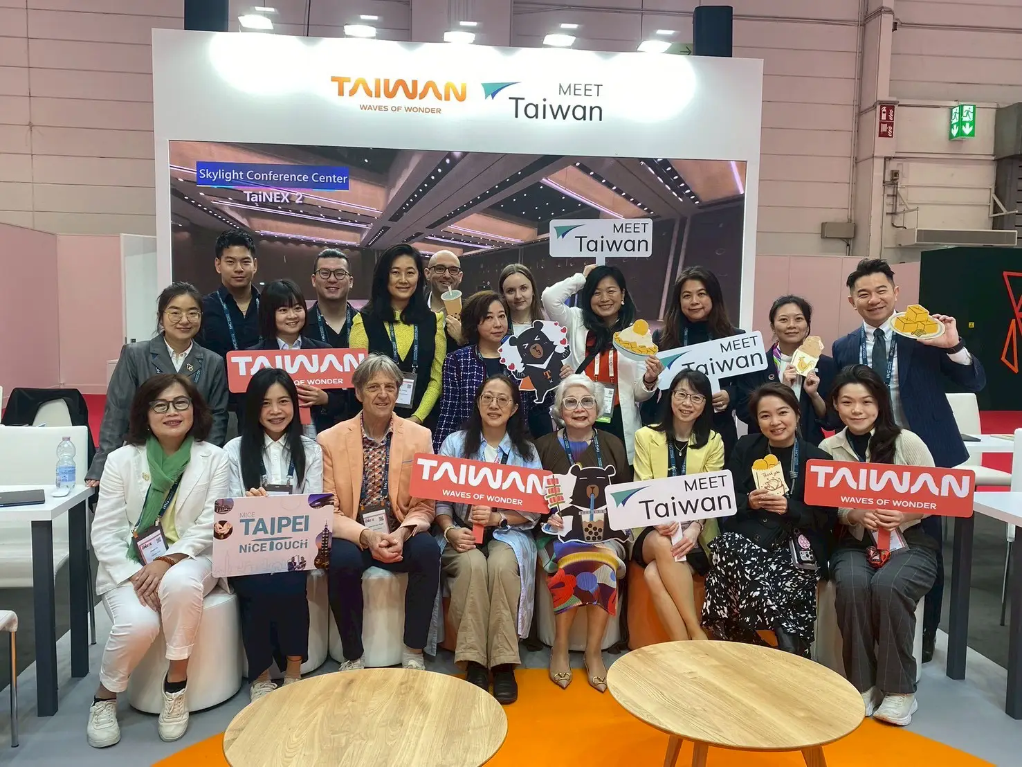 Taiwan MICE Pavilion team poses with international buyers and promotional signs at IMEX Frankfurt 2026