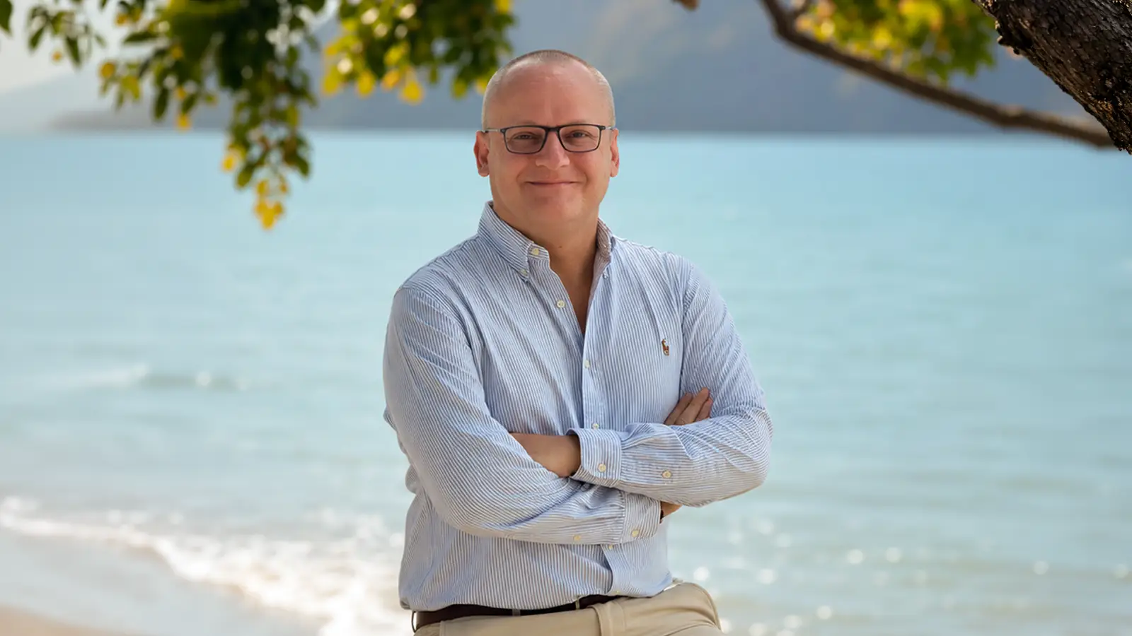 Erik Billgren, General Manager of Anantara Koh Yao Yai Resort and Villas, standing on the resort beach with turquoise sea in the background