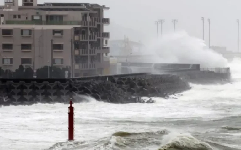 Aviation 17 Storm waves crash against a coastal seawall in Japan during Tropical Storm Jangmi as rough seas hit the shoreline.