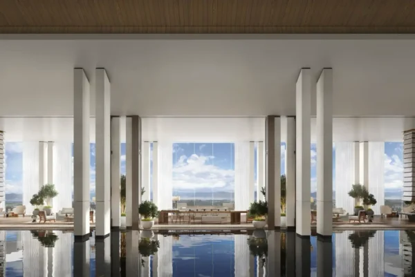 Elegant indoor reflection pool and lounge area at The Dali EDITION, featuring floor-to-ceiling windows with views of Erhai Lake and the surrounding mountains.