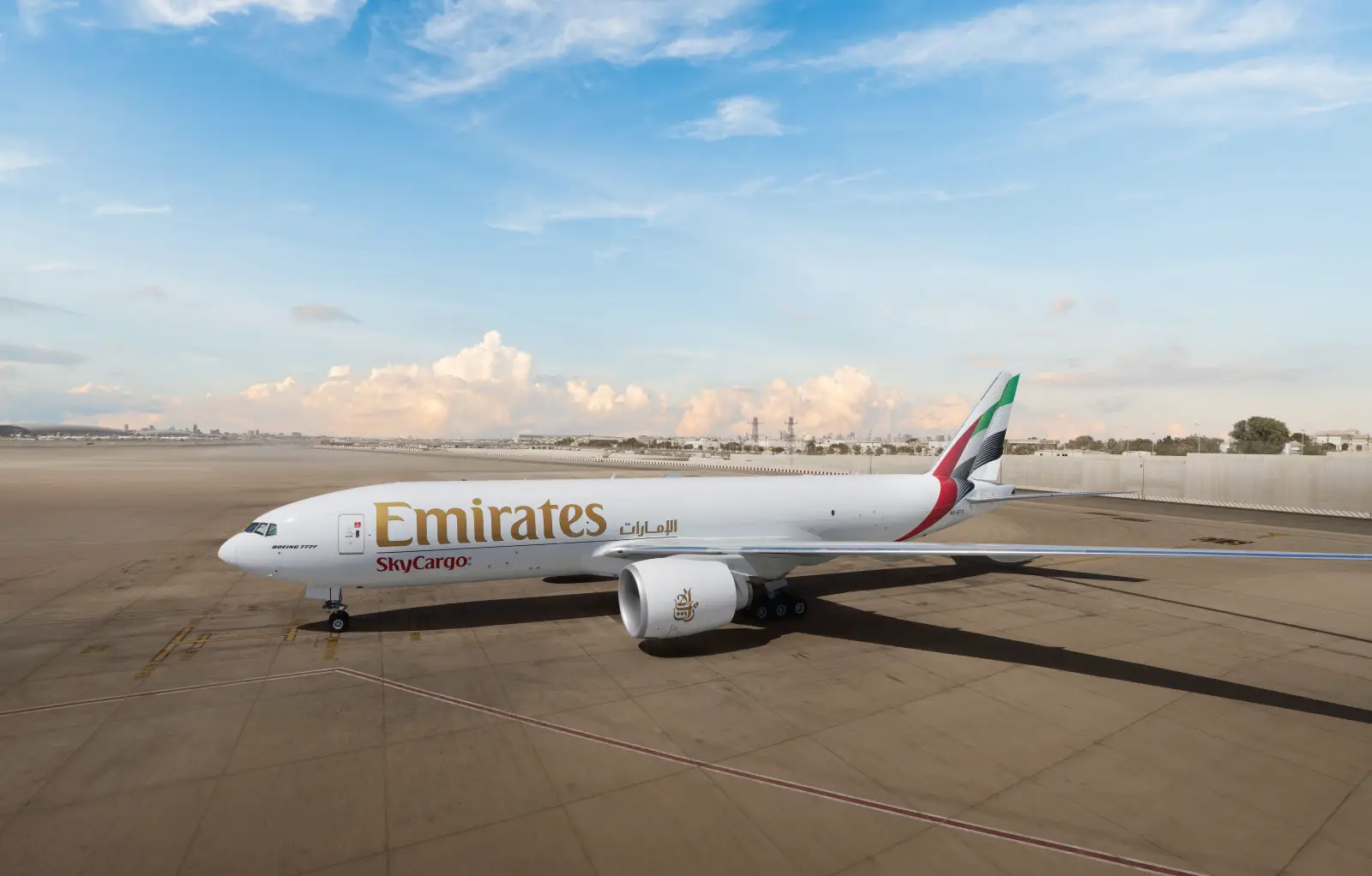 Emirates Skycargo Flies Specialist Dogs To Zimbabwe To Combat Poaching 3 Emirates SkyCargo Boeing 777F freighter aircraft parked on the apron at Dubai International Airport under a clear sky.