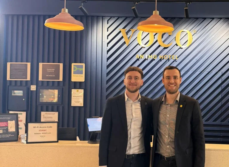Joe Davidovitz and James Watson standing at the reception desk of voco Winchester Hotel & Spa following their leadership appointments.
